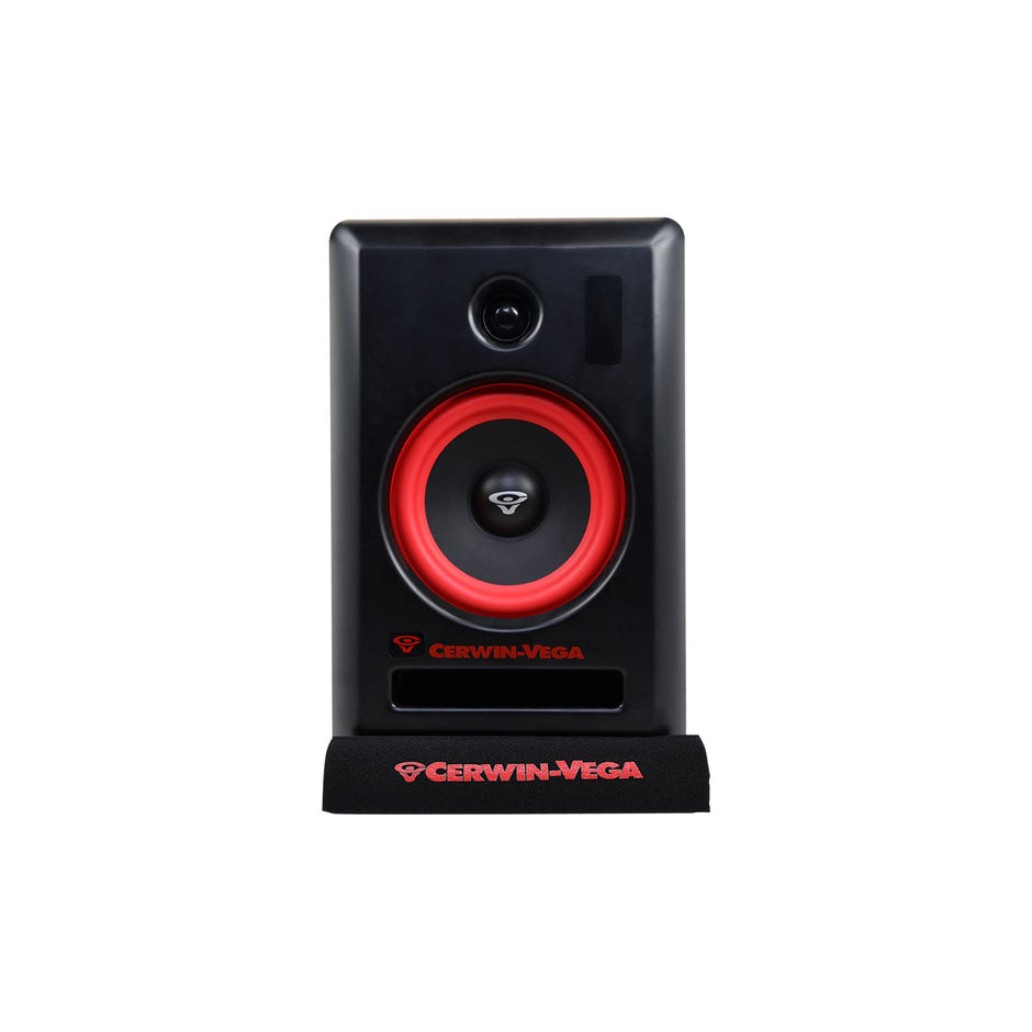 The black Cerwin-Vega speaker features a red circular woofer and center logo, built into a rectangular enclosure with a horizontal bass port below and a smaller logo. Enhanced with V4SPAD isolation pads, it rests on a stand adorned with the red Cerwin-Vega logo.