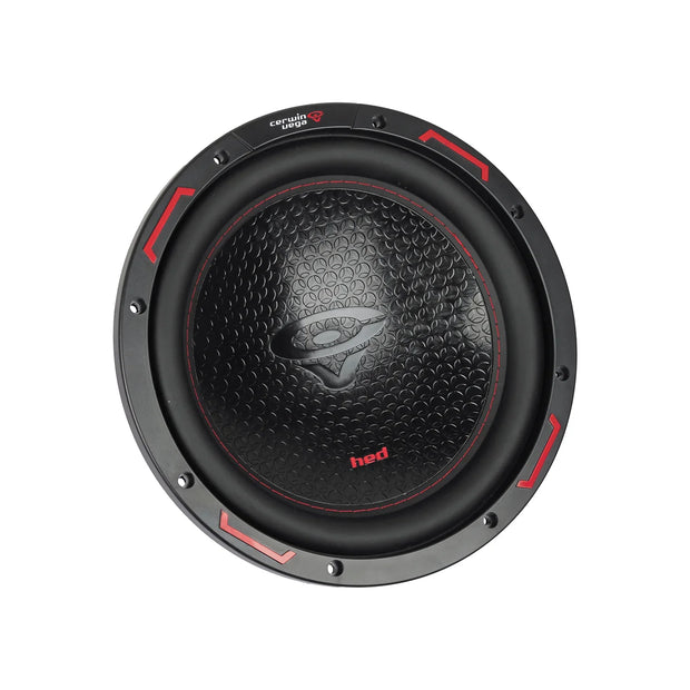 The image shows the HED 2025 Edition black 10-inch CERWIN-VEGA subwoofer featuring red accents. The textured central cone displays a stylized logo, brand name, and "hed" text. Red triangular markings on the outer ring add a dynamic design touch.