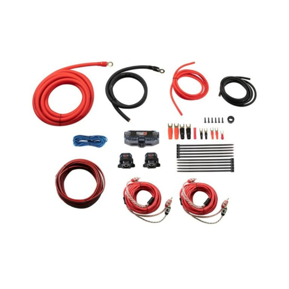 The Amp Kits include red and black cables of various lengths, blue wire, connectors, zip ties, a fuse holder, two fuses, coiled speaker wires, RCA cables, terminal connectors, and a distribution block—arranged neatly on a white background.