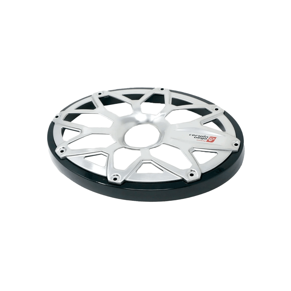 The RPM Stroker 6”X9” Flush Mount Speaker Grill, Pair (Black) - SM69FGB features a metallic, circular truss disc with a shiny silver finish, eight angular asymmetrical spokes, and black outer edges. It includes a small red and black logo on the right side with stylized text.