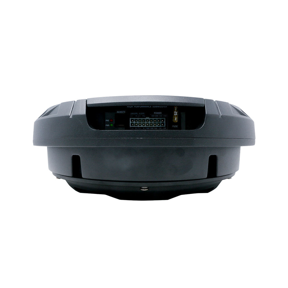 The Spare Tire Subwoofer is a black, circular car audio device with a visible control panel featuring various connectors and settings, including a reset button. Its rugged design includes perimeter ridges against a white background.