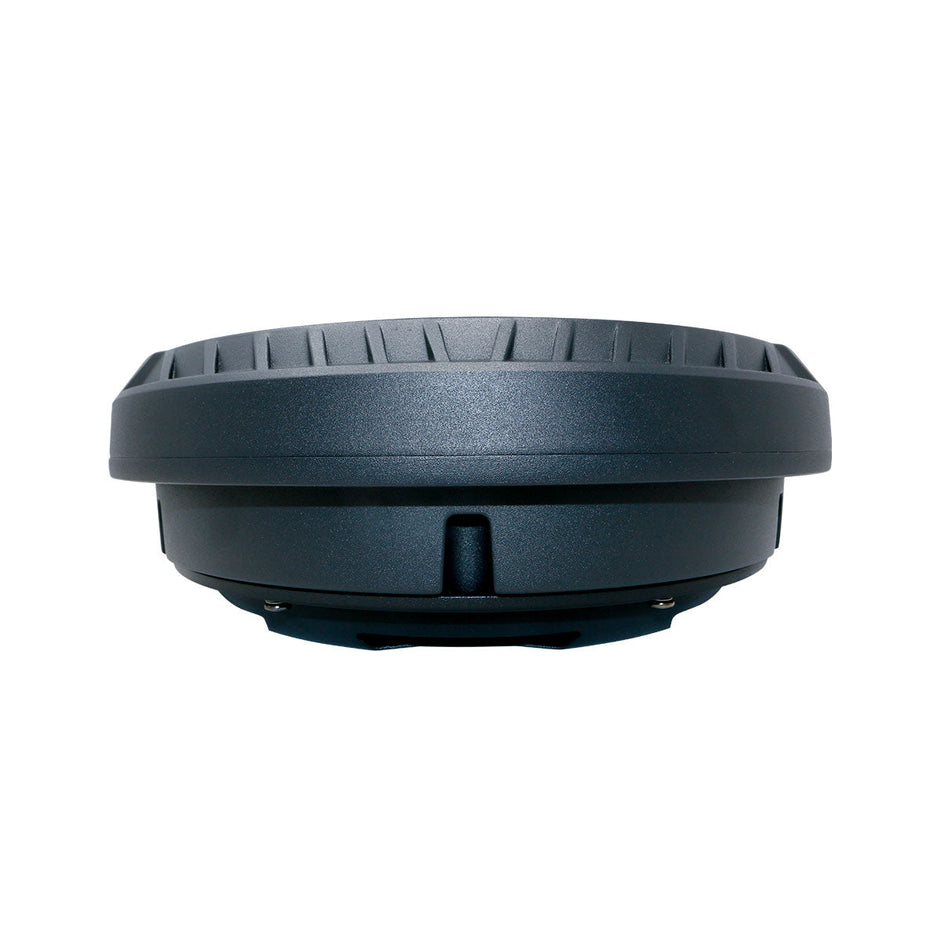 Close-up of a round, dark gray Spare Tire Subwoofer with a grooved top surface. Its sleek design features subtle ridge details along the circumference and a thicker lower part with a small notch, hinting at modularity or a base component.