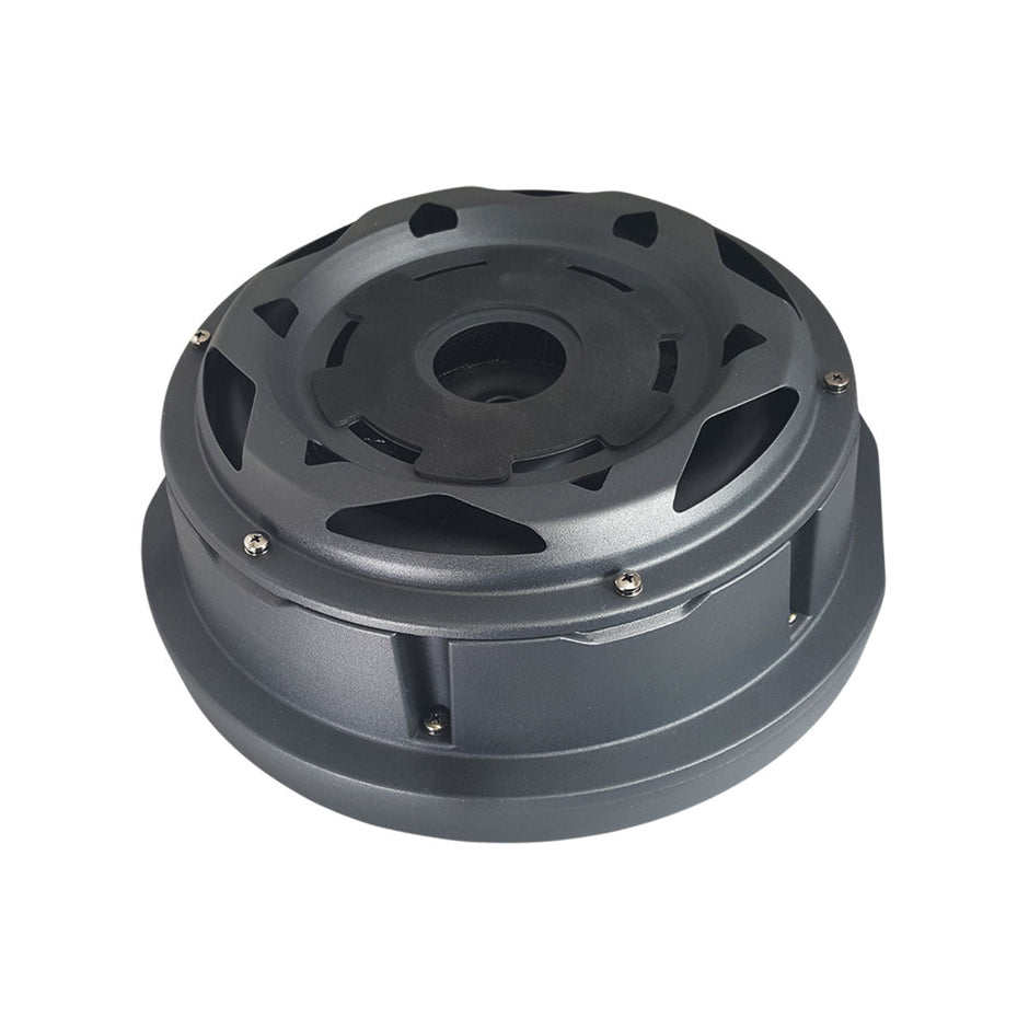 The Spare Tire Subwoofer is a round, metallic gray device with multiple layers. Its top has circular cutouts secured by screws, and the design features vents and intricate details, indicating an industrial or technological purpose.