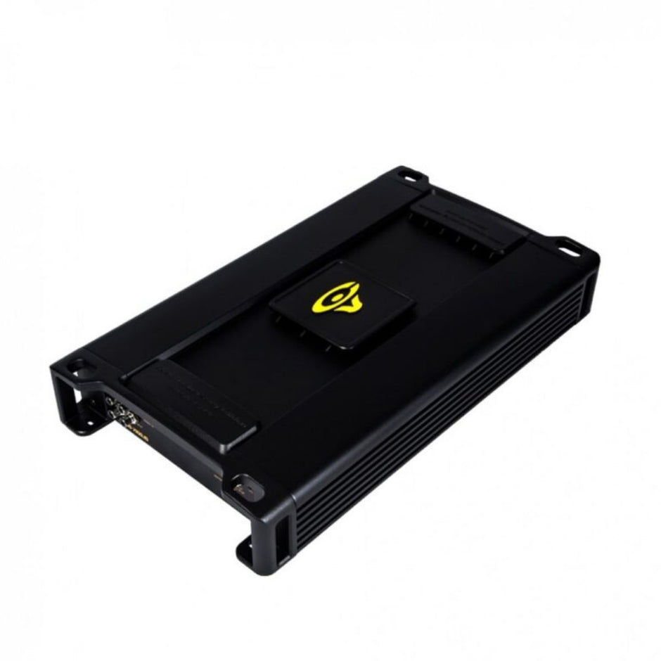 The Stroker Pro Amplifier is a black, rectangular car audio amplifier with a sleek design, featuring cooling fins on the sides and rounded corners. A yellow logo is centered on top, with input and output ports on one end. It rests elegantly on a white background.