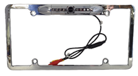 The Chrome HD License Plate Frame with Backup Camera - CLF1C features an embedded camera and is enhanced with six infrared LEDs. It includes a black cable with red and yellow connectors for video and power, and the chrome frame has four mounting holes.