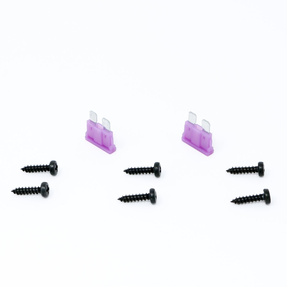 Two purple rectangular blade fuses and six black screws are neatly arranged on a plain white background. Ideal for optimizing the CVP Series 1-Channel Class AB Amplifier - CVP2000.1D, the fuses have vertically oriented prongs, while screws are aligned in two rows of three with pointed ends and flat heads.