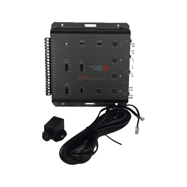 A black control unit labeled "IOEM88" with various switches and knobs is shown next to an aftermarket amplifier setup. It has numerous side connectors, and a long black cable with a small sensor or camera appears in front, all against a white background.