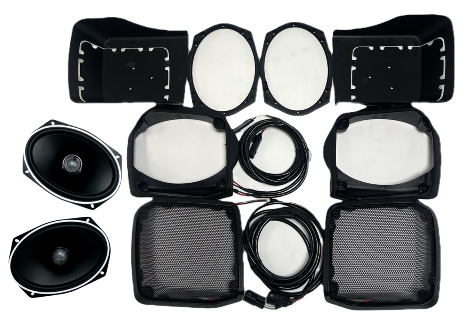 The 98-2013 Harley Davidson Cut-in Lid Kit with ST69CX (4Ω) is meticulously arranged on a white background, featuring oval speakers, protective casings, round filters, and lengthy coiled cables for an exceptional audio clarity experience and enhanced audio upgrade.