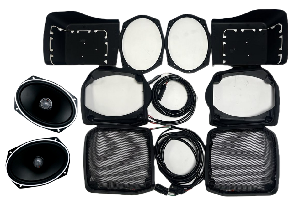 The 98-2013 Harley Davidson Cut-in Lid Kit with ST69CX (4Ω) is meticulously arranged on a white background, featuring oval speakers, protective casings, round filters, and lengthy coiled cables for an exceptional audio clarity experience and enhanced audio upgrade.