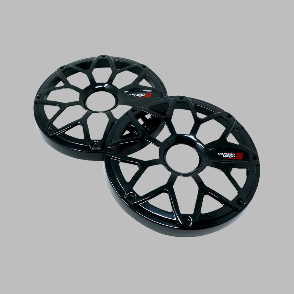 Two black car wheel center caps with a multi-spoke design sit against a gray background, featuring a 